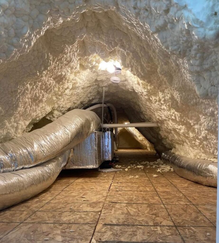 Sealed attic finished in spray foam with insulated ductwork running through it