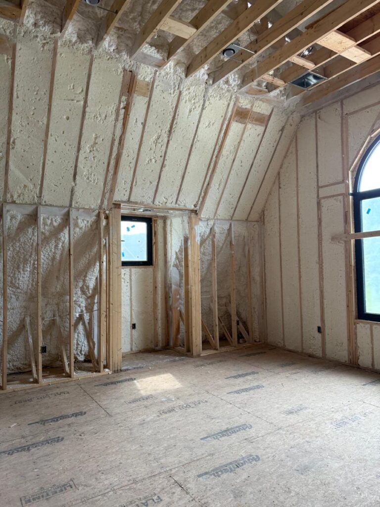 Foam-insulated knee walls and sloped ceiling in a second-floor room