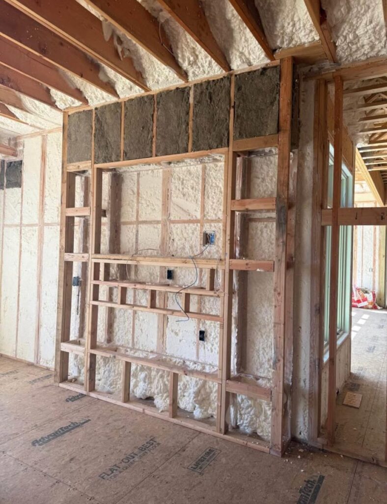 Spray foam and mineral wool combined in one wall assembly